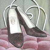 Vintage 60s 70s snakeskin shoes pumps by FAITH in brown.  They are very stylish and are labeled a 5. Insole 8 5/8