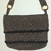 Retro 60s vintage gold metallic purse handbag that is either knitted or crocheted.  It is made from a woven fiber with gold metalic and black threads. It is very heavy, has a layered design. Measures 10 x 7 1/2 and is in excellent condition.