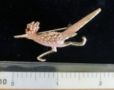 Gold tone enameled road runner brooch