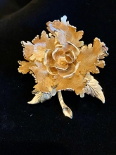 Goldtone mechanical flower brooch signed Warner NY