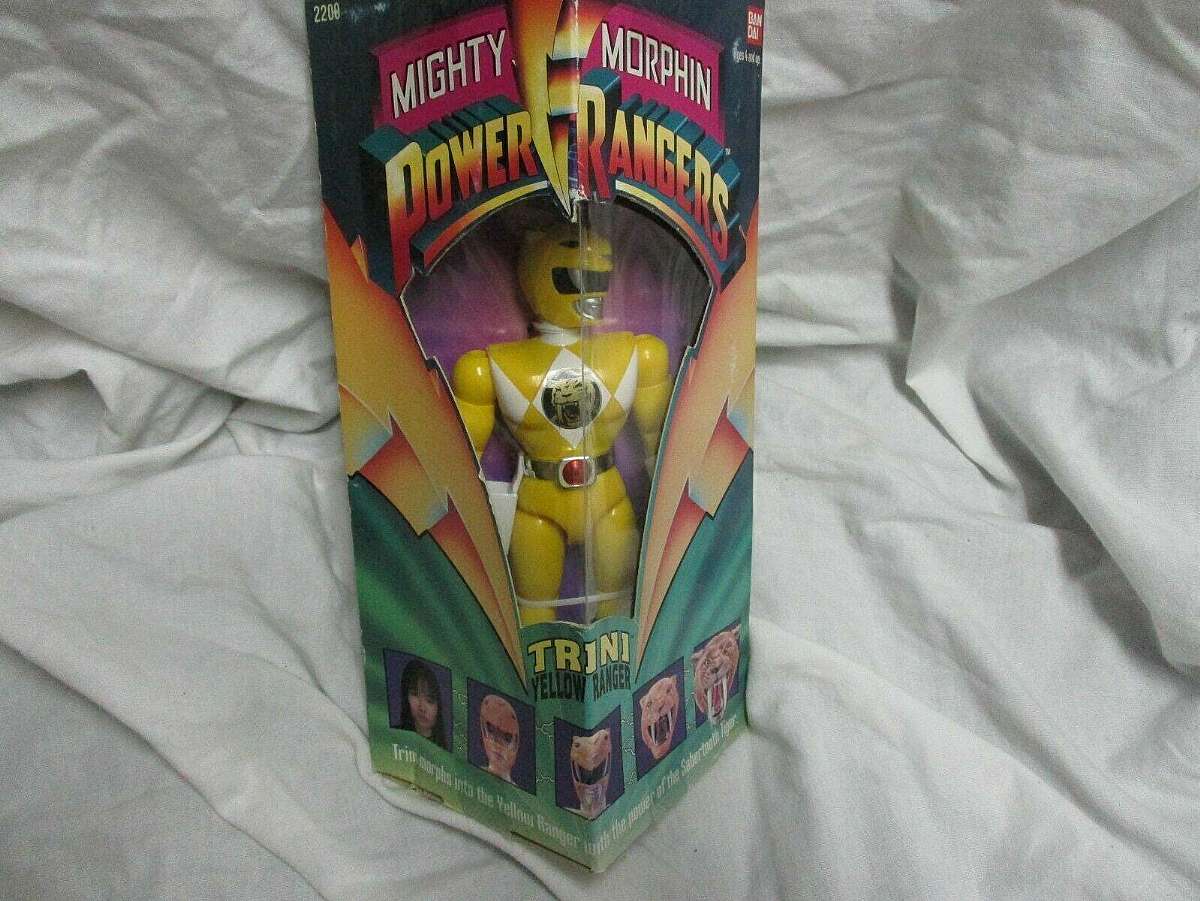 New in original factory box.The 1993 Mighty Morphin Power Rangers Trini Yellow Ranger collectible is a nostalgic piece that holds value for fans of the popular TV show. This figurine, representing the Yellow Ranger, appeals to collectors of fantasy and my
