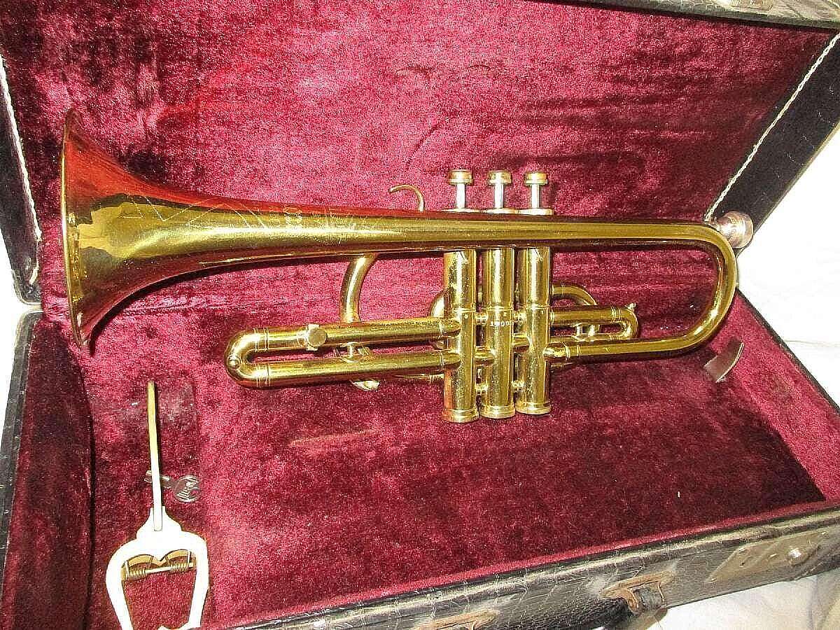Vintage trumpet with original case. Will look used but does work.Listed as good condition.The product is a vintage 1950's Frank Holton Elkhorn, Wisconsin trumpet/cornet with its original carrying case. This unique piece of musical history is a valuable co