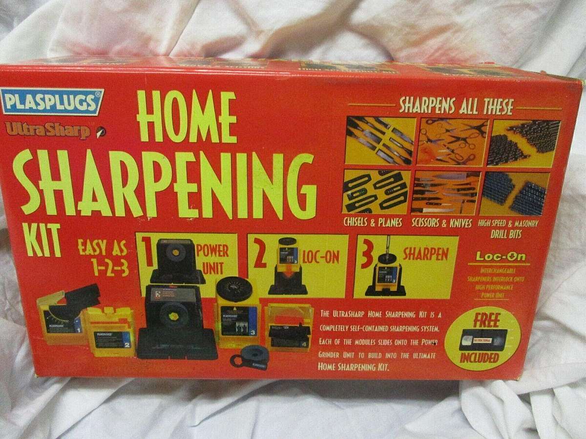 New old stock and in the original factory box.The Plasplugs Ultrasharp HomeE Sharpening Kit is a convenient tool for sharpening knives, drill bits, and other tools in your workshop or home. The kit includes various tools and accessories, along with a VCR