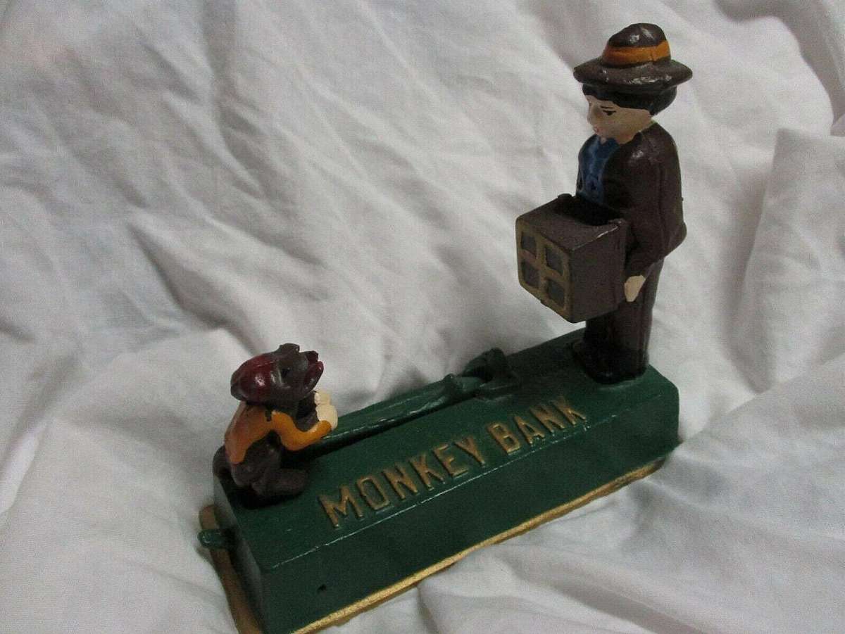 Will be in used condition. Still works.The Vintage Bits and Pieces Jumping Monkey Cast Iron Bank is a unique and quirky collectible item perfect for those who appreciate vintage and whimsical pieces. This cast iron bank features a jumping monkey design, a