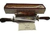 Comes in factory box.Vintage India Sword/Dagger 1 dagger with hand crafted wood handel and 1 dagger fork with hand crafted handel and they come in a Carved hand crafted wood case.The daggers blades have lubricant on them so they do not rust.In very good