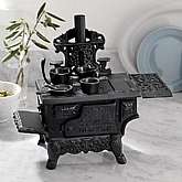 Solid cast iron minature cooking stove.New old stock.