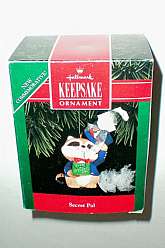 Hallmark Keepsake Christmas Tree Ornament -- Secret Pal -- Dated 1992New in factory package or box or factory sealed.