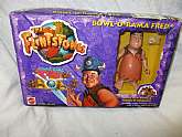 The Flintstones Bowl-o-Rama Fred Figure with accessories. Make him bowl a Strike -o-Rooney. New old stock but factory box will not be in perfect condition. Box never opened. Playset.