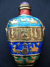"Enameled Glass Snuff Bottle, China - with Case"This beautiful piece I have had for 50 years.  I have no information on the age of the piece.  When I was a little boy, I admired it sitting in my grandmother's large curio.  One of the objects s