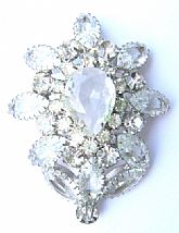 This is pretty close to the prettiest rhinestone pendant I have ever sold.  It is 2" wide x 2 1/2" in height 
and 5/8" in thickness.  This piece is from the 1960's and interestingly designed.  
