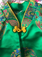 This beautiful emerald green embroidered jacket is unused and has been kept in a protective cover since 1965.

My brother was stationed in Seoul Korea with the Air Force in 1964. He gifted this coat to me and I have kept it unworn and protected since.