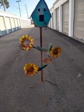 Antique bird cage with flower andwelcome sign with flower