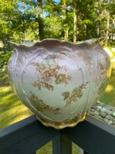 It's always amazing when pieces such as this are found intact. A very large sized jardinere from end of the 19th century. Victorian in style, with a floral pattern and gold embellishments. Is in good vintage condition, no chips or cracks,
