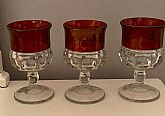 Vintage Indiana Glass Thumbprint Ruby Red Clear Water/ Wine Goblet Glass, set of 3.

Good condition. No chips, breaks, or repairs. A bit of fading of the red band. Some of the light amber shows through.

2.5" W x 4.5" H