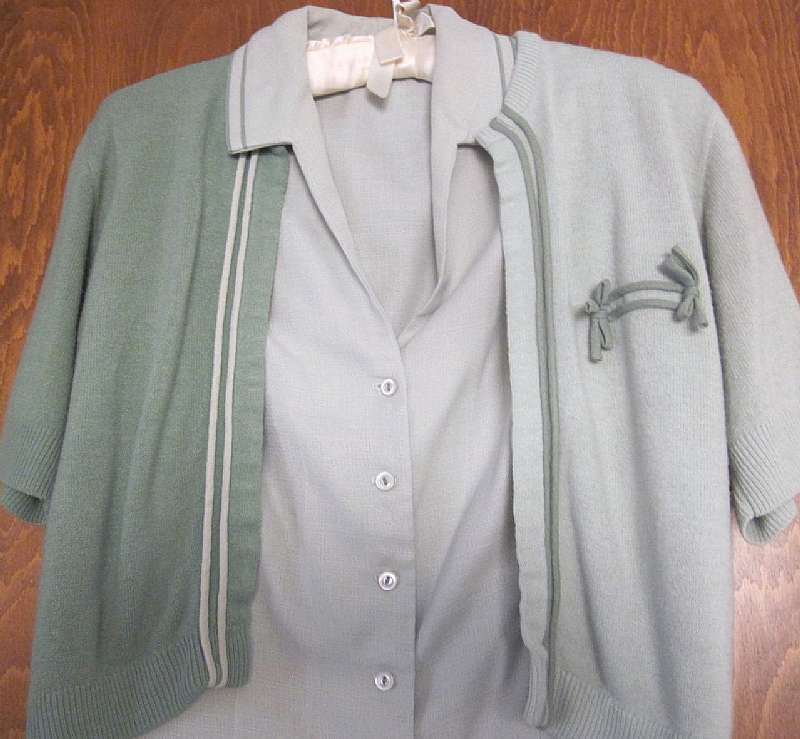 Super cute 3 piece suit in good condition.  Pix don't do it justice.  The 2-tone sweater is so cute with a little bow detail.  The blouse is sleeveless and the skirt and light green piping at waistband.  The skirt is lined but hem appears to have been alt