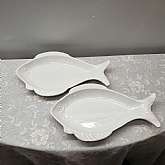 Mid Century Modern Pair of Glossy White Fish Art Pottery Fish Plate or Platter Oven Proof USA California In good condition, no chips or cracksMeasures 17" long by 9.5"DThese are great for display and use as needed.  From Oven to table.Th