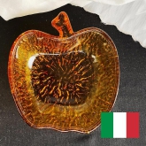 It's a lovely hand made amber glass plate in apple shape mad in Italy.