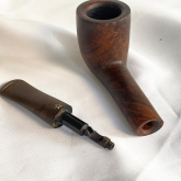 It's a lovely handmade pipe in brown color by old Turkish brand Sahin.
