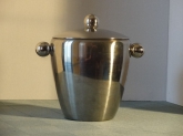 Handsome silver ice bucket, too nice to hide. Perfect for entertainment or display.