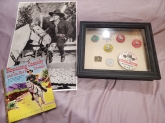 Shadowbox with pins, two pictures & a book