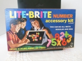 Box says "Contains 36 Lite-Brite Numbers & Symbols" but there are more and various other pegs included