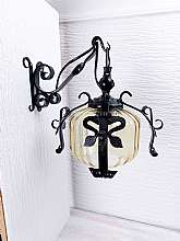 Old mid-century wall lamp sconce. A local blacksmith made a beautiful light in the mid-60s. It is made of iron and is hand forged.It can be used for outdoor or indoor lighting. Very well preserved.Easy to fasten with two screws. Dimensions: Height: