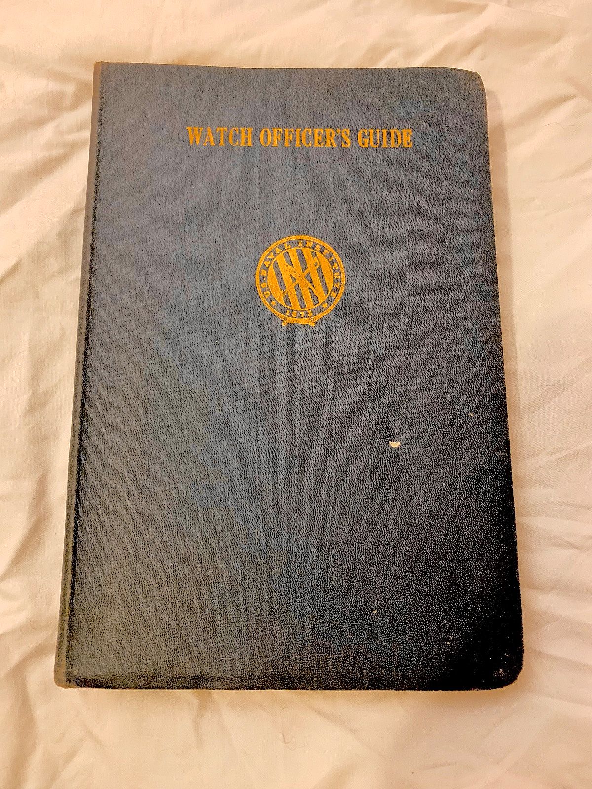 This is a soft leather covered book titled "Watch Officer's Guide - U.S. Navy". This book is from 1941/ Corrected Reprint 1942. Book measures approx. 7.75"T x 5.25"L x 5/8"W.  There are 319 pages. This book is in overall Fine condition.