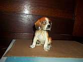 Truly a  rendition of a floppy, half grown beagle pup...with all the charm of the squatting/sitting pose.....Measures 3.25" to the top of the rounded head above the floppy ears and 2.50 to the tucked around tail.  Note the oversized paws....this pup