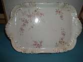 Beautiful undamaged victorian era dresser tray decorated with delicate florals. Can be a multipurpose tray......unobtrusive but beautiful......dresser, bath, dining room, living room, kitchen. Displays beautifully with or without additional items.