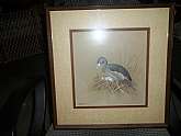 Beautiful waterfowl print from a noted artist, famous for his renditions of nature's feathered water dwellers. Professionally framed, simple walnut finish frame and perfect mat. Shows signature and date in lower left corner. Framers' label on reverse on d