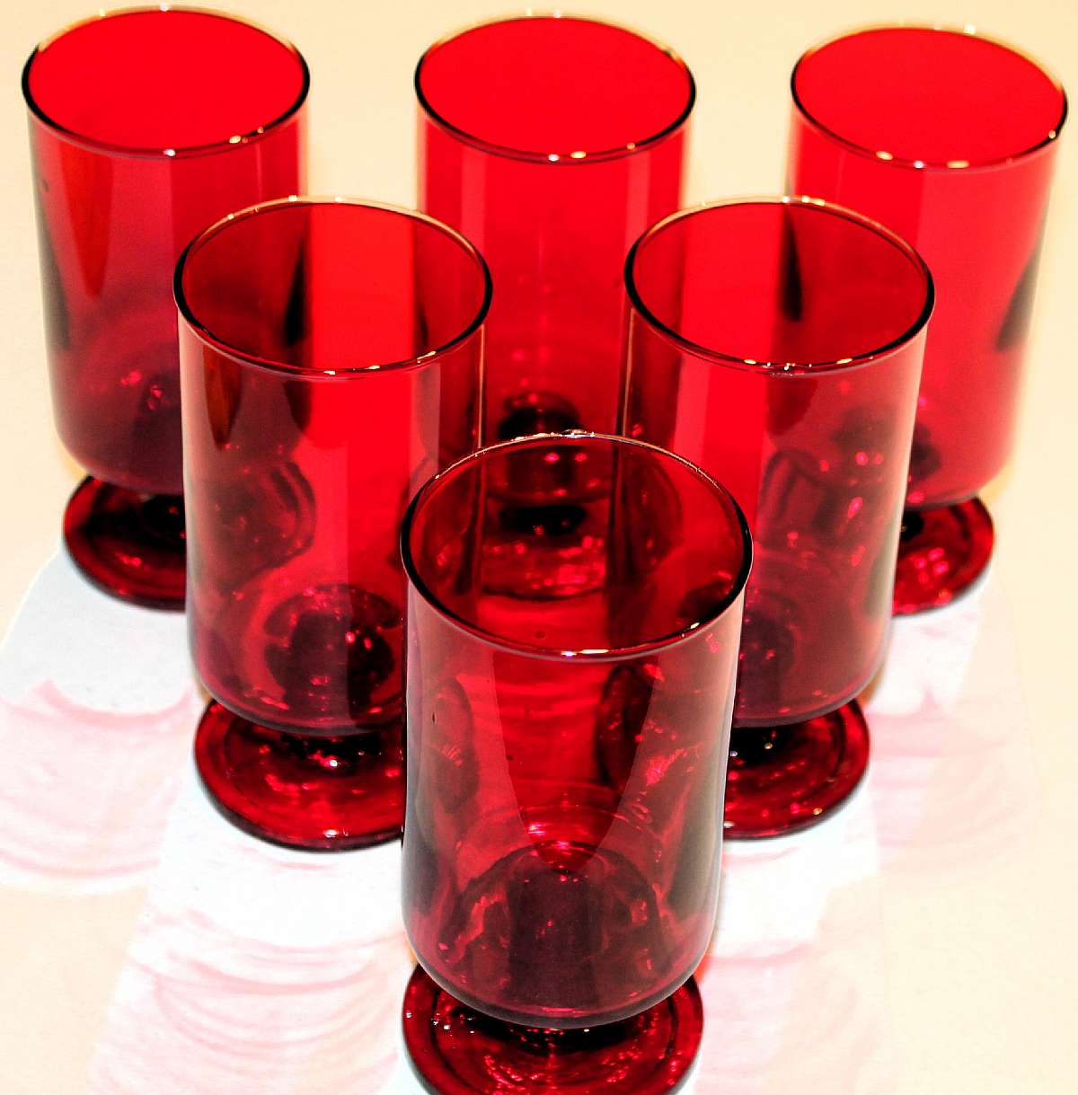 Up for sale are these Vintage Ruby Red Set Of Six Footed Glasses in excellent condition with no chips or cracks. They measure approx. 5 7/8"T by 2 3/4"W. Shipping Excludes: Alaska/Hawaii, US Protectorates, APO/FPO, PO BoxShipping Provided to t