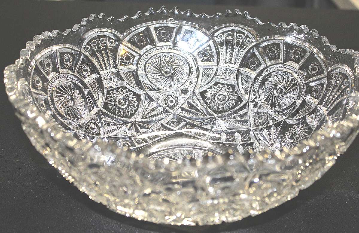 Up for sale is this Vintage Large Pressed Glass Saw Tooth Beautiful Bowl. It measures approx. 12"W by 5 1/4"T.  The condition is excellent with no chips or cracks. Very fine in display. The appearance is excellent and it radiates in sparkle and