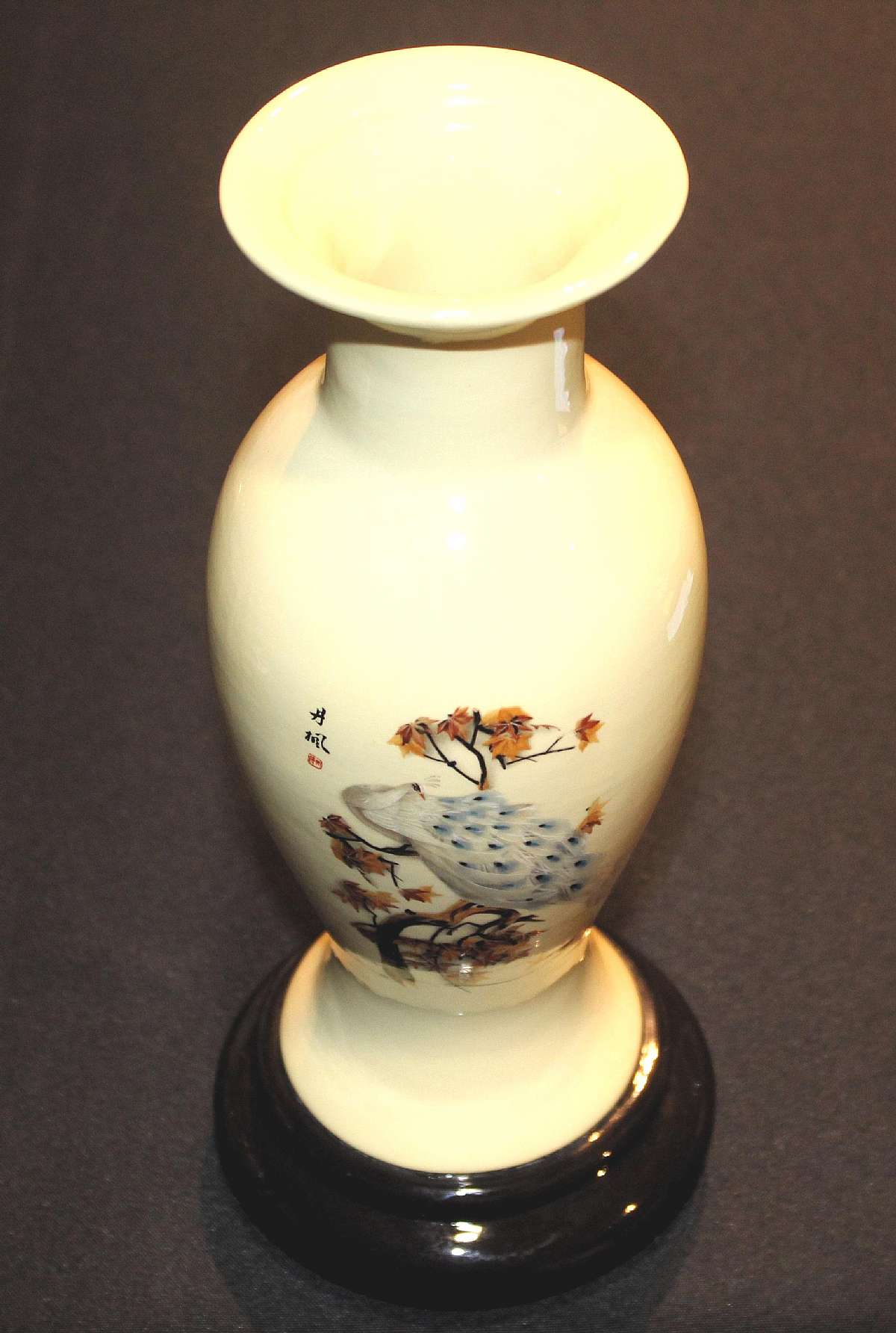 Up for sale is this Japanese Decorative Vase With A Peacock Design in great condition with no chips or cracks. Measures approx. 11 3/4"T and is marked on the front and has DMD on the reverse. Looks like someone had flowers in it.Shipping Excludes: A