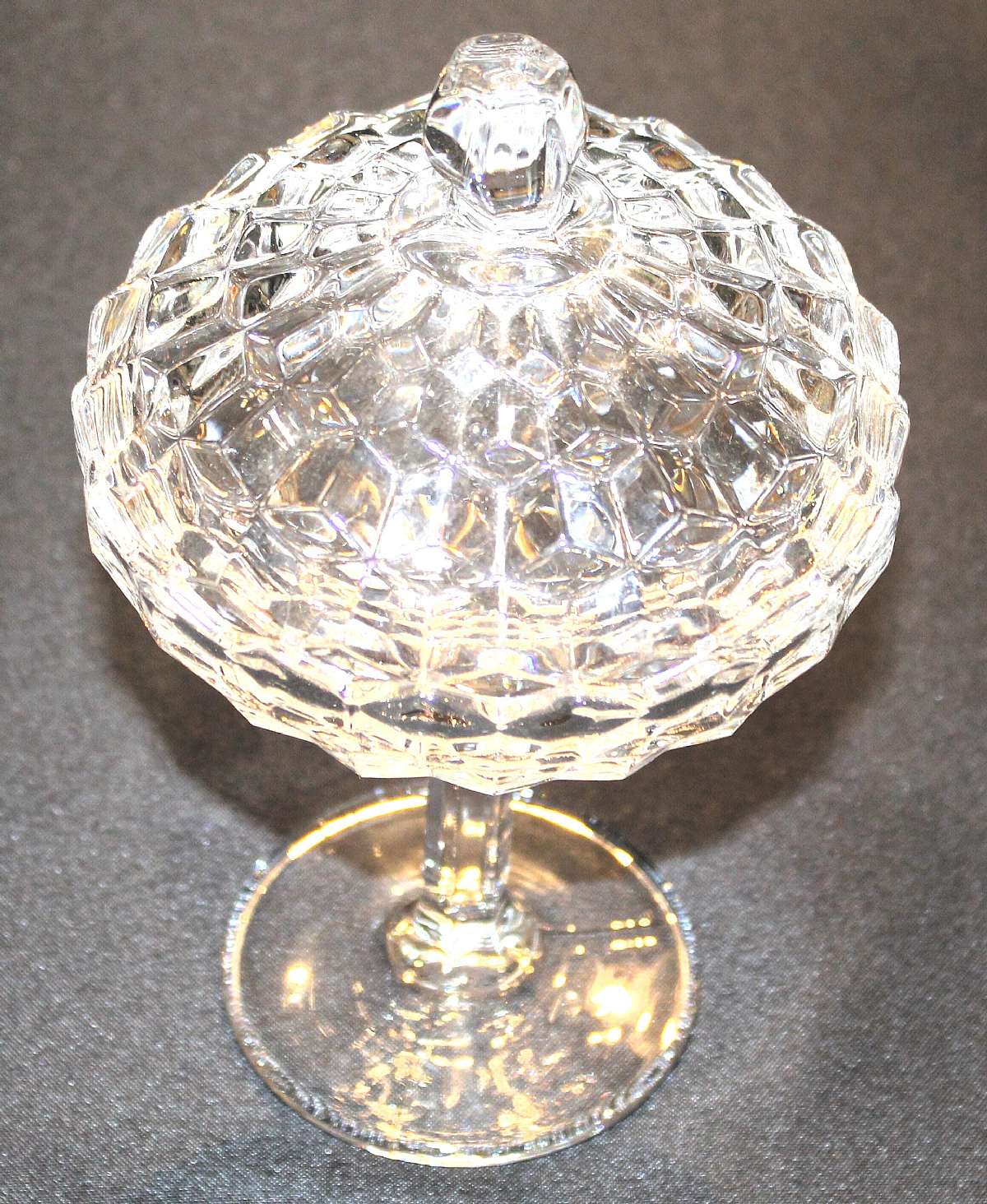 Up for sale is this Fostoria American Compote Dish With Lid. Measures approx. 6 1/8"T without the lid and is in excellent condition with no chips or cracks.  Shipping Excludes: Alaska/Hawaii, US Protectorates, APO/FPO, PO BoxShipping Provided to th