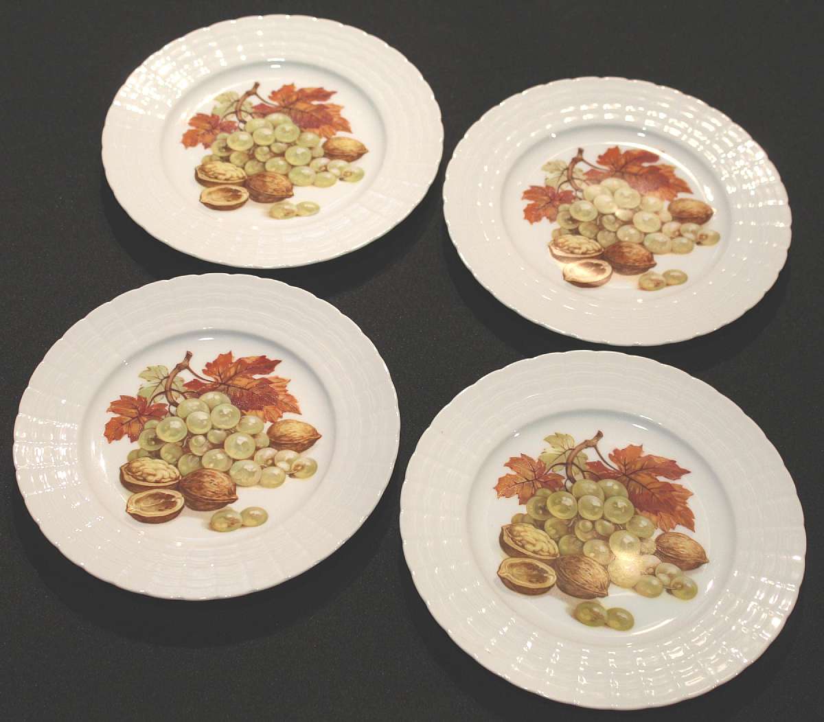 Up for sale are these Hutschenreuther Germany Grape & Walnut Set of Four Plates in excellent condition with no chips or cracks. The plates measure approx. 8"W.  Shipping Excludes: Alaska/Hawaii, US Protectorates, APO/FPO, PO BoxShipping Provide