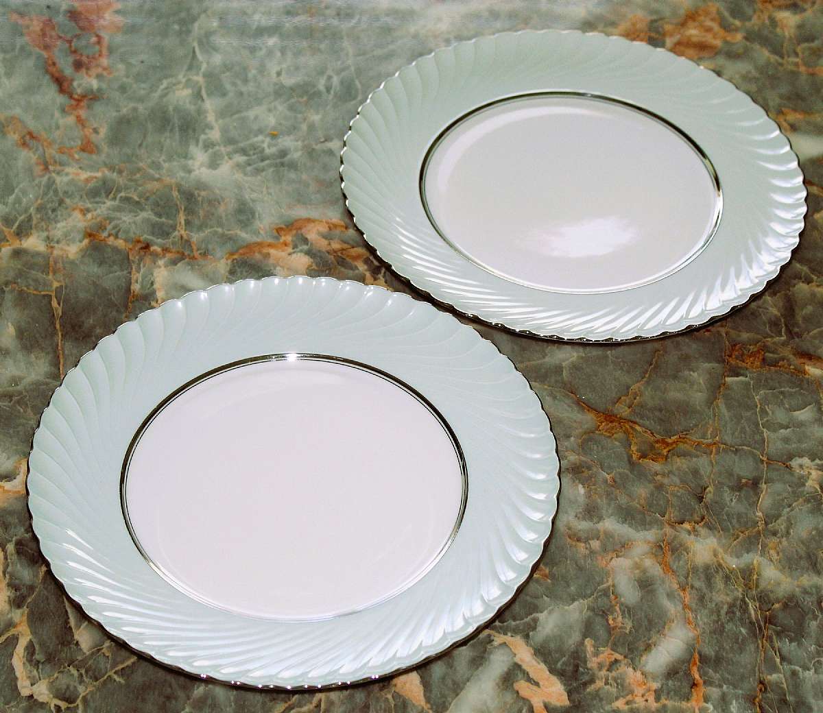 Up for sale are these Rare Royal Tettau South Wind Grey Green Set Of Two Dinner Plates in excellent condition with no chips or cracks. They measure approx. 10 3/4"W.  Please see my other sales for more of this beautiful pattern.Shipping Excludes: Al