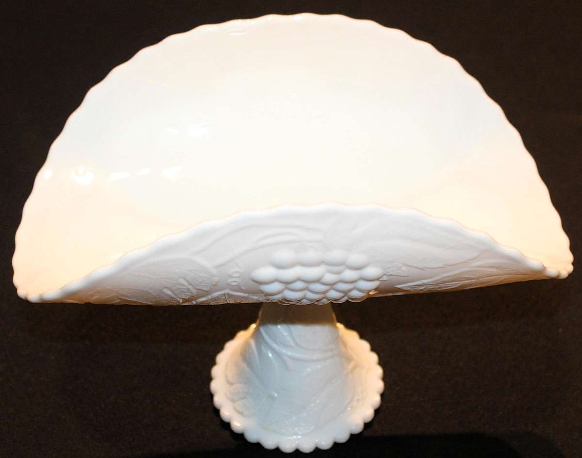 Up for sale is this Smith Glass Footed Banana Boat Milk Glass Grape Design in great condition with no chips or cracks. The bowl measures approx. 12 1/4 inches wide & about 8 3/4 inches high. Beautiful Piece.Shipping Excludes: Alaska/Hawaii, US Protec