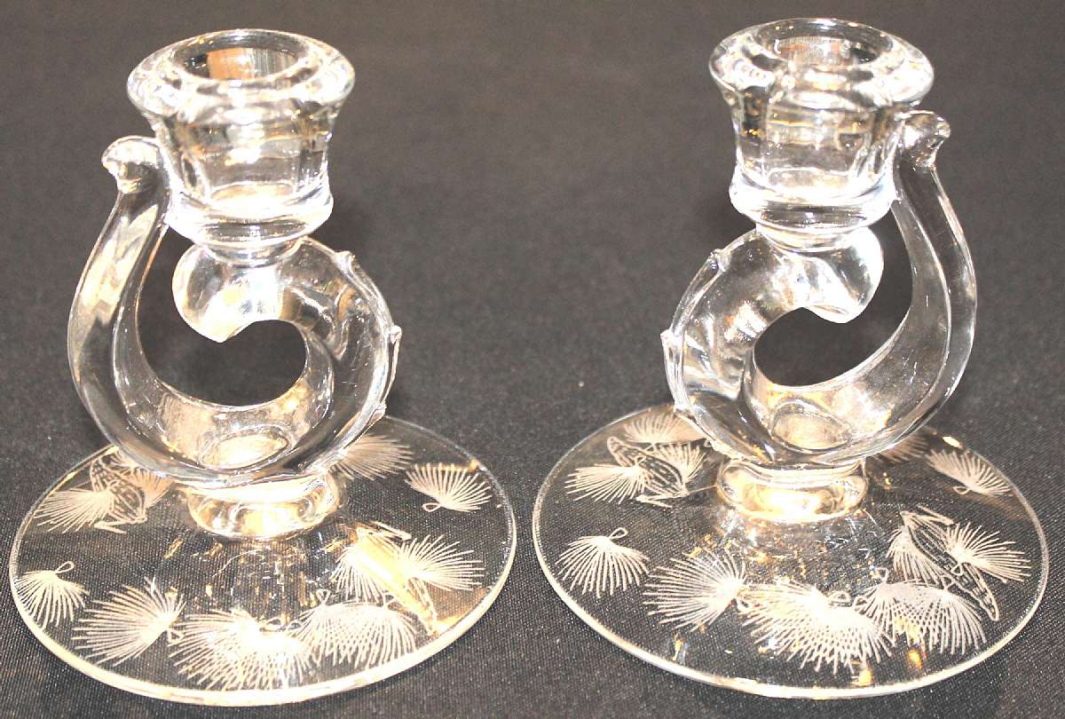 Up for sale are these Etched Fostoria Milkweed Set Of Two Candlestick Holders in excellent condition with no chips or cracks. They measure approx. 4 1/2 inches wide. The Etching is on the bottom reverse. Shipping Excludes: Alaska/Hawaii, US Protectorates