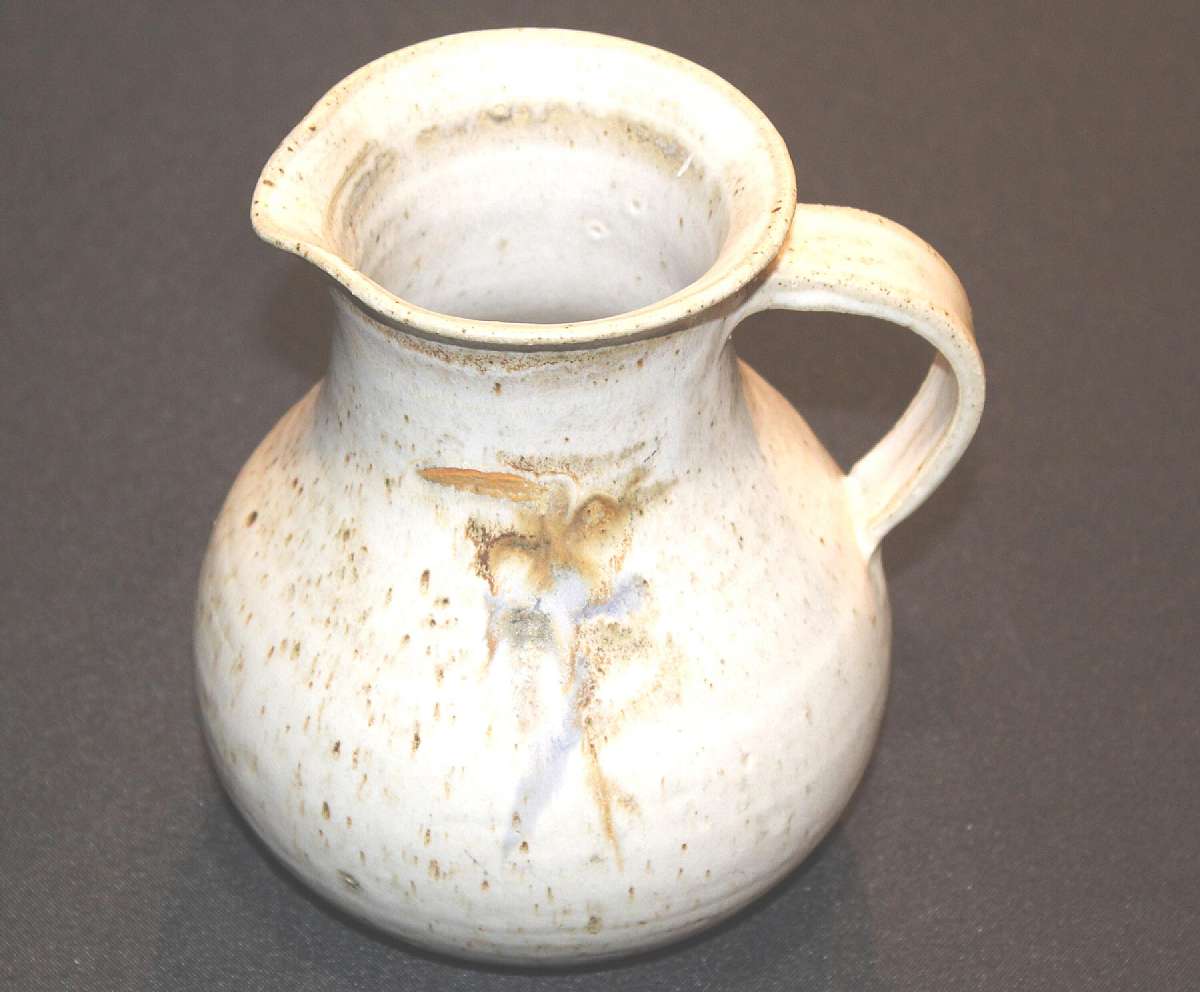 Up for sale is this Art Studio Signed Decorative Pottery Pitcher Jug in excellent condition with no chips or cracks. It measures approx. 7"T by 4"W at the top and holds approx. 45 ounces.Shipping Excludes: Alaska/Hawaii, US Protectorates, APO/F