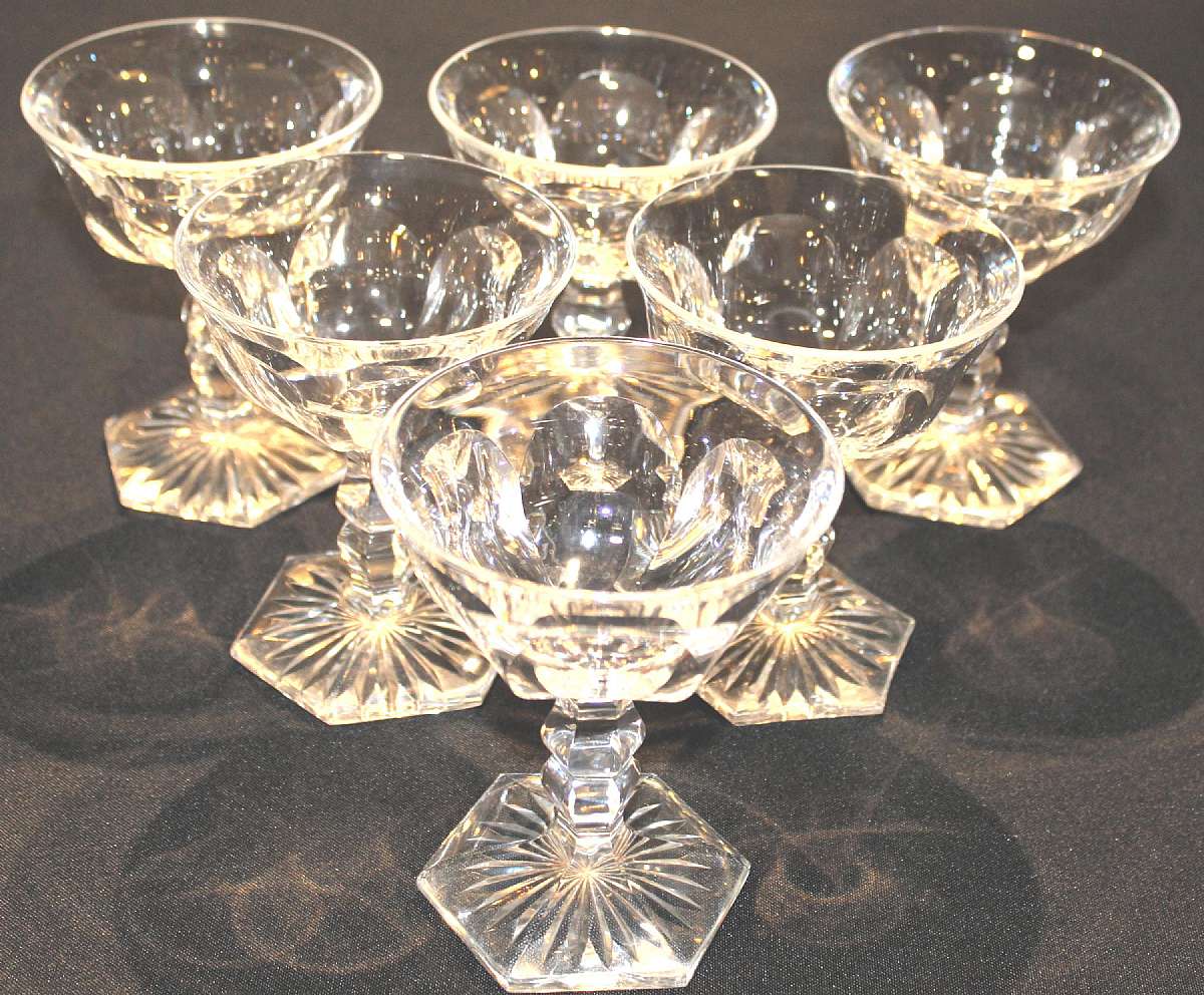 Up for sale are these Beautiful Crystal High End Set Of Six Champagne Glasses with cut panels and multi-sided foot in excellent condition with no chips or cracks. They measure approx. 5 Inches Tall and 4"W.  I do not know the pattern.Shipping Exclud