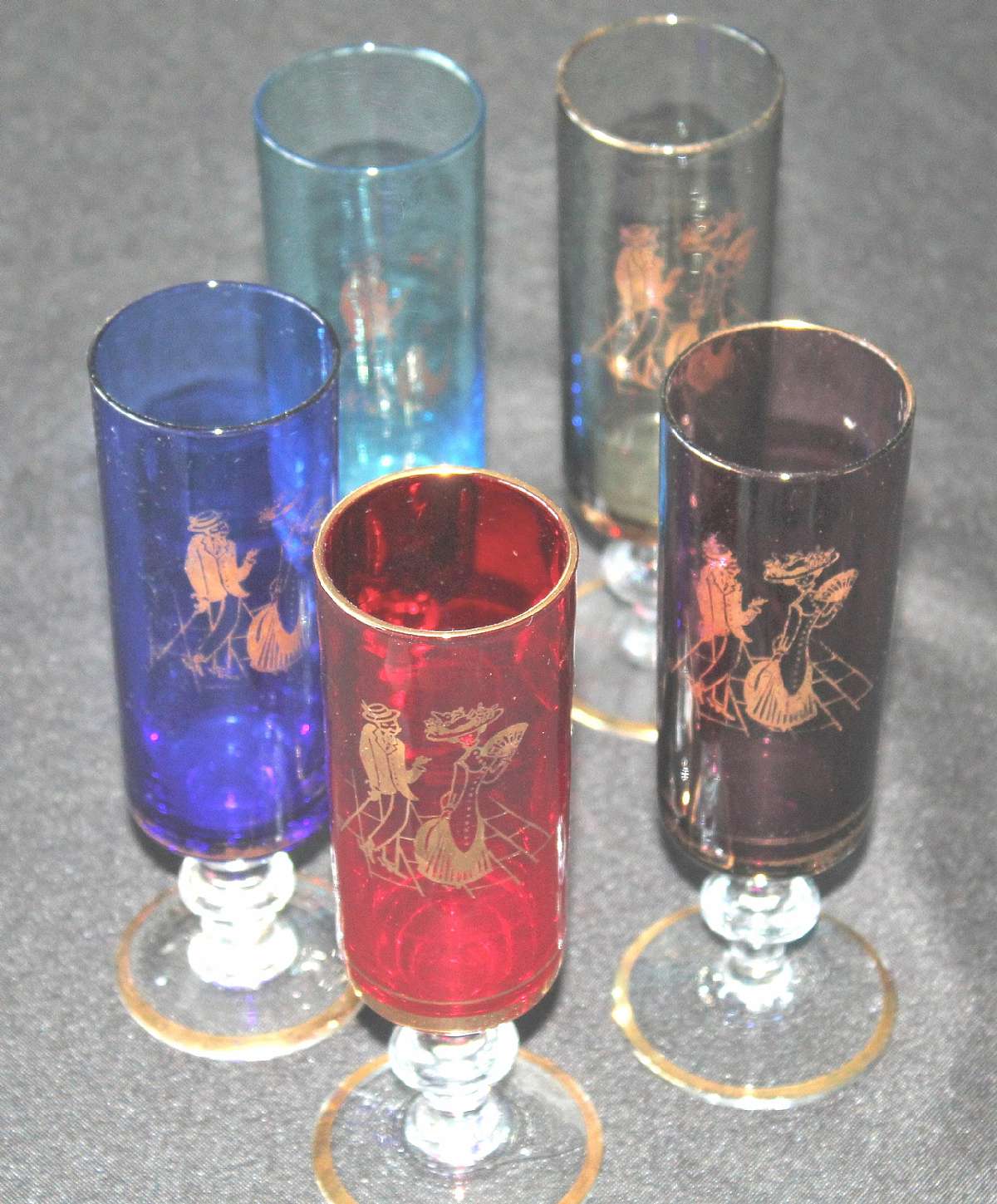 Up for sale are these Courting Scene Vintage Set Of Five Glasses. They measure approx. 6 5/8"T by 1 7/8"W.  There are no chips or cracks. There is some gold wear. Shipping Excludes: Alaska/Hawaii, US Protectorates, APO/FPO, PO BoxShipping Prov