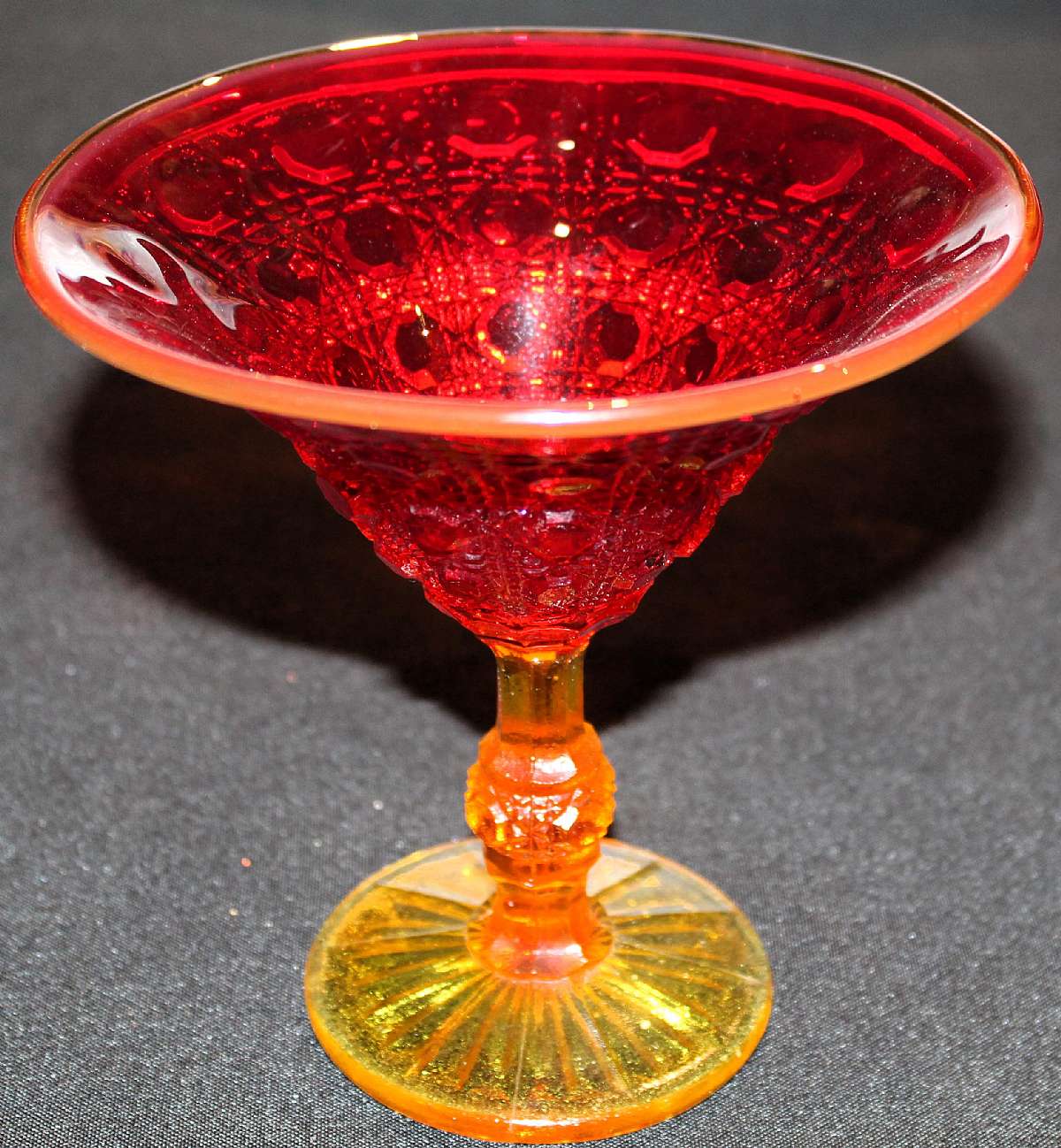 Up for sale is this Amberina Coin Dot Design Beautiful Compote in great condition with no chips or cracks. it measures approx. 6 1/8 inches tall and 6 inches wide. Shipping Excludes: Alaska/Hawaii, US Protectorates, APO/FPO, PO BoxShipping Provided to t