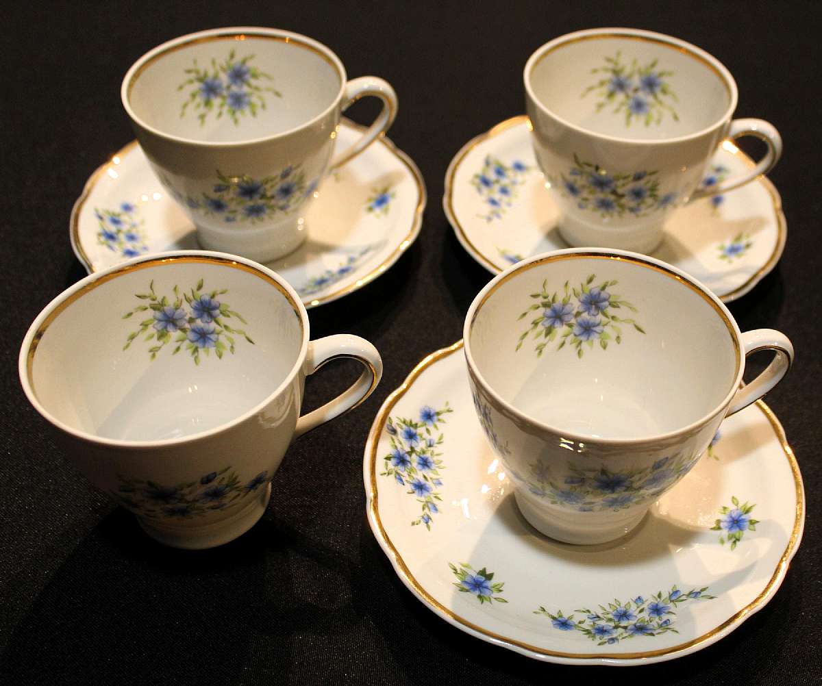 Up for sale are these Cmielow Condia Poland Set Of Four Cups & Three Saucers in excellent condition with no chips or cracks. The cups measure approx. 3"T by 3 3/8"W and the saucers 5 7/8"W. Please See my other sales for more of this pat