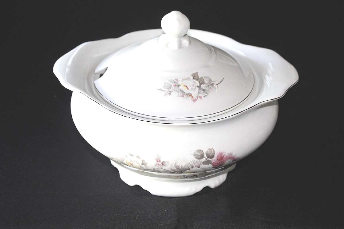 Up for sale is this Schmidt Porcelain White Rose Soup Tureen in excellent condition with no chips or cracks. The silver rim probably platinum is excellent as well. It measures approx.11 5/8"W by 5 3/8"D. Manufacturers imperfections on inside bot