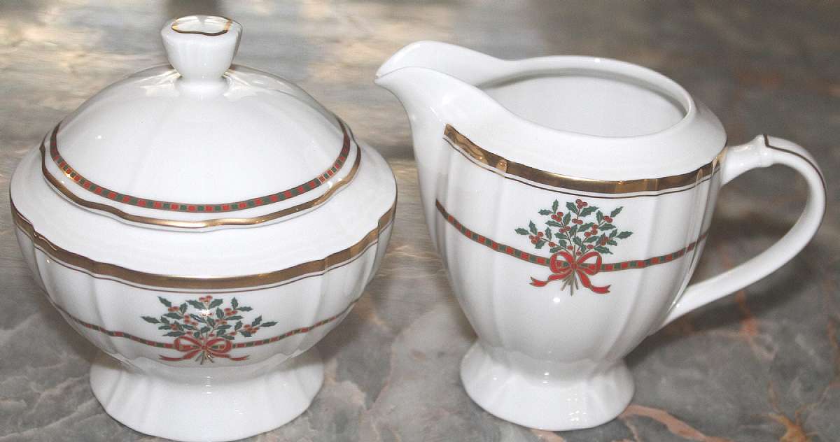 Up for sale is this Mikasa Christmas Garden Creamer & Sugar Bowl With Lid in excellent condition with no chips or cracks. The creamer is approx. 3 7/8"T & the sugar bowl is 3"T. Please see my other sales for more of this beautiful patter