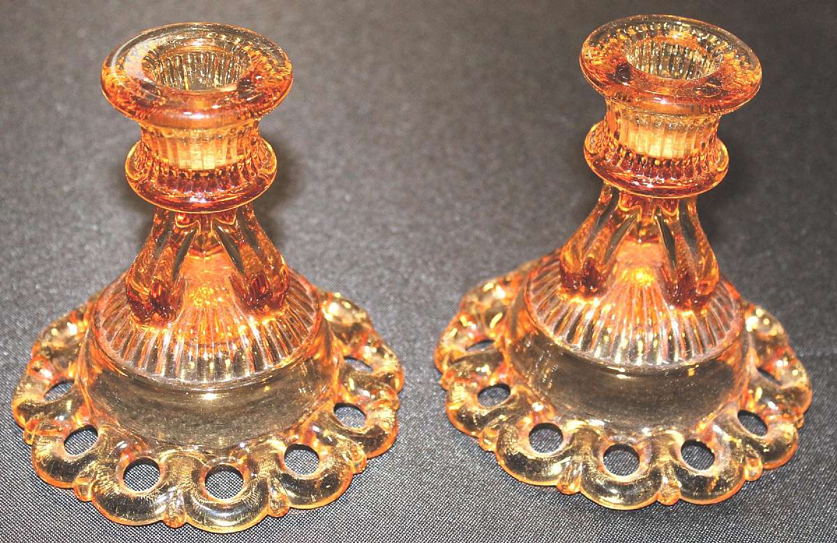 Up for sale are these pair of Westmoreland Colored Laced Edged Glass Circa 1930 Candle Stick Holders in great condition with no chips or cracks. They measure approx. 4 1/2 inches tall. Nice color. Marked with the WG on the reverse. Shipping Excludes: Ala