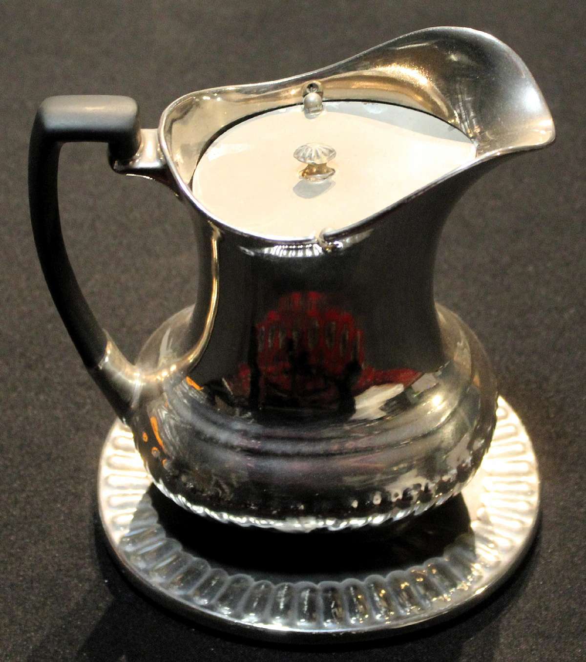 Up for sale are these Devon Ware Silverine Pitcher & Underplate in Used condition with no chips and some crazing and silver wear. Included is One Underplate that the pitcher can sit on and one pitcher with the lid.Shipping Excludes: Alaska/Hawaii, US