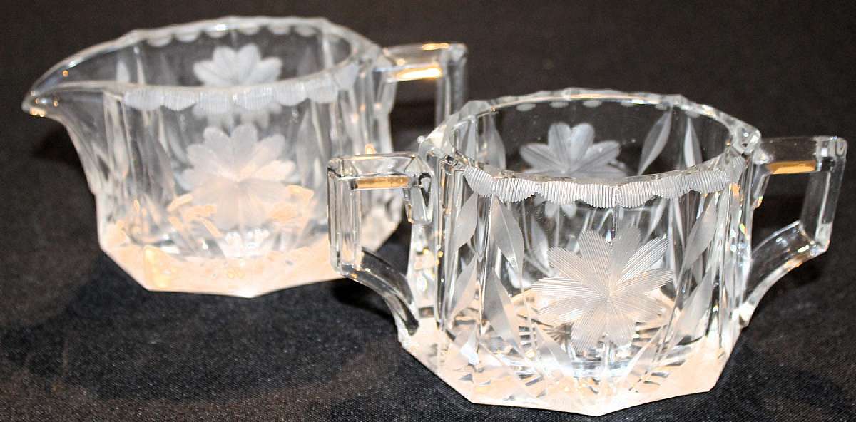 Up for sale are these beautiful antique well made Heisey Marked Heavy Etched Floral Creamer and sugar bowl. Each is marked with the H in a diamond and one says Patd 7/9/12. They measure approx. 3"Tall. The creamer does have a very very small flee bit
