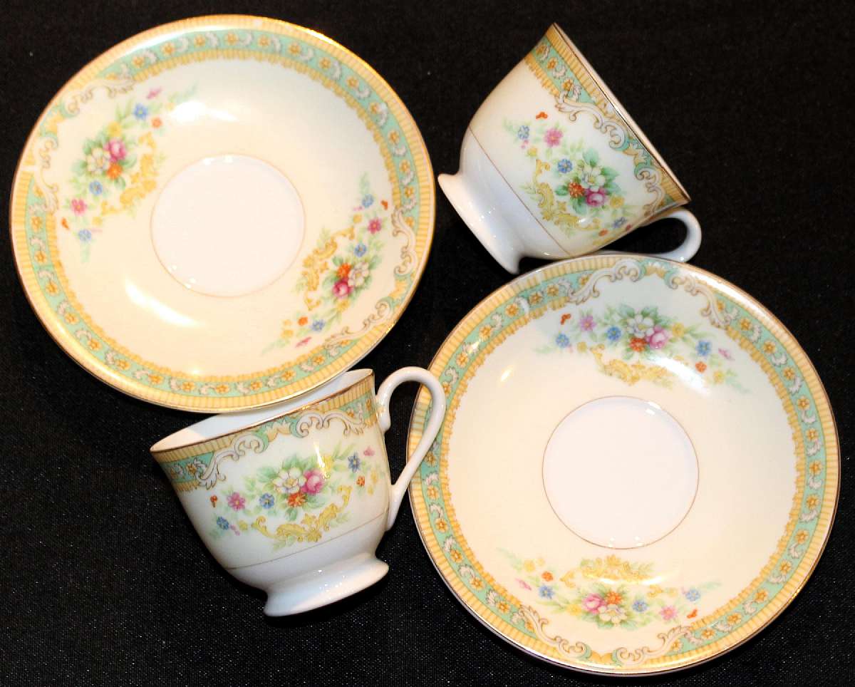 Up for sale are these Occupied Japan Set of two Matching Demitasse Cup & Saucer Sets with no chips or cracks. The cups measure approx. 2 1/8"T by 2 1/2"W. The saucer is 4 3/4"W.  Marked with a G in a wreath. This was a Noritake contract mark for Giftcraft