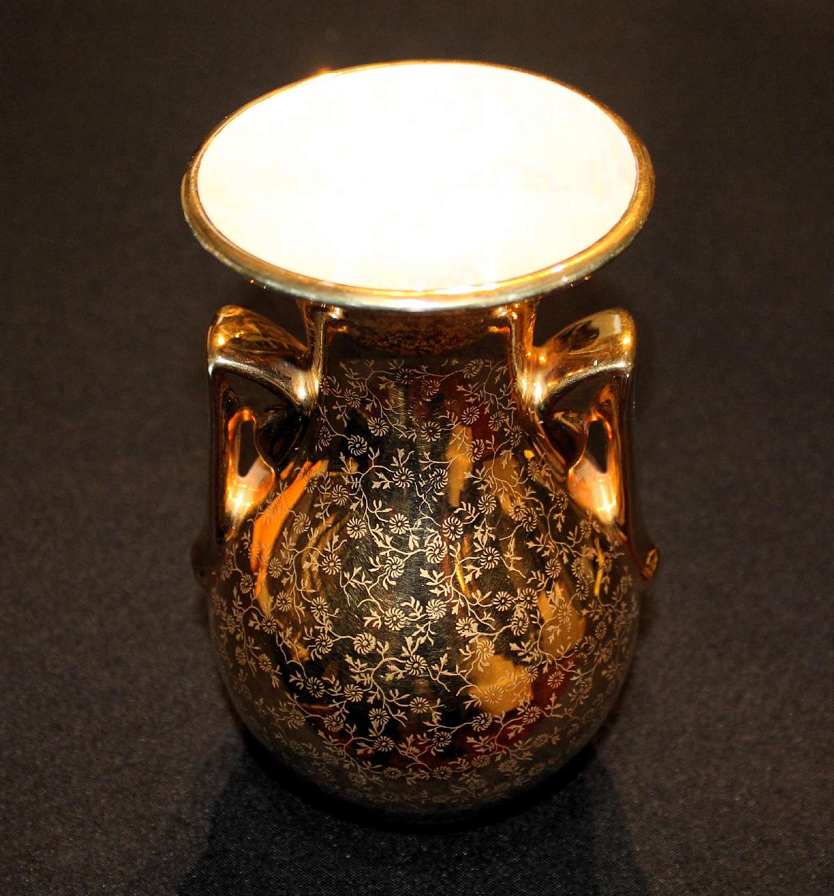 Up for sale is this vintage Pearl China Company Vase 22kt Gold Hand Decorated Vase in excellent condition with no chips or cracks. Measures about 7 1/4"T.Shipping Excludes: Alaska/Hawaii, US Protectorates, APO/FPO, PO BoxShipping Provided to the Un